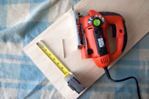 A board of wood with a wood sander on it