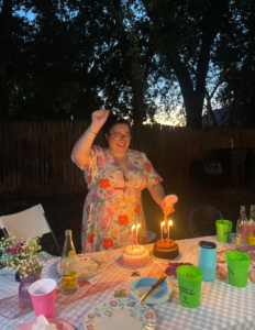 Juliana celebrating at her Goodwill Garden Party for her birthday with items she obtained from a Goodwill thrift store.